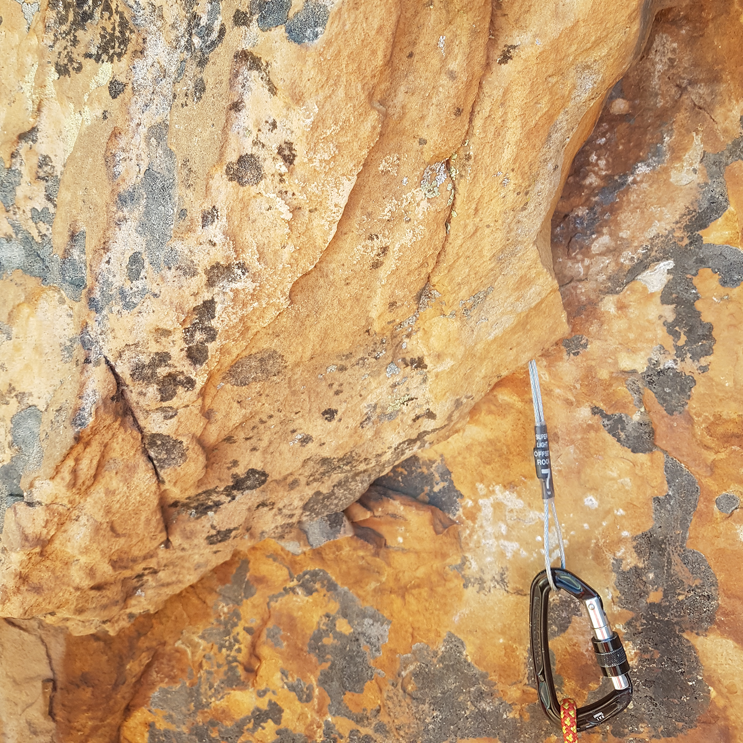 Refillable coloured climbing chalk blending into Australian Sandstone in the Arapiles