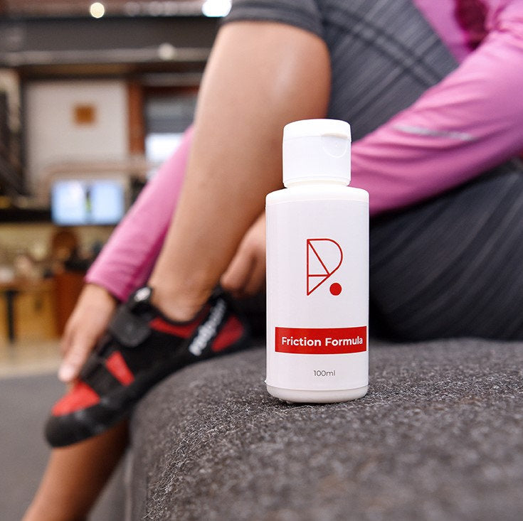 Redpoint climbing liquid chalk friction formula original used at a indoor bouldering gym