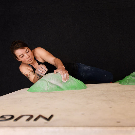 Redpoint climbing australia liquid chalk friction formula soothing clove used at a indoor bouldering gym Stef Kujawa